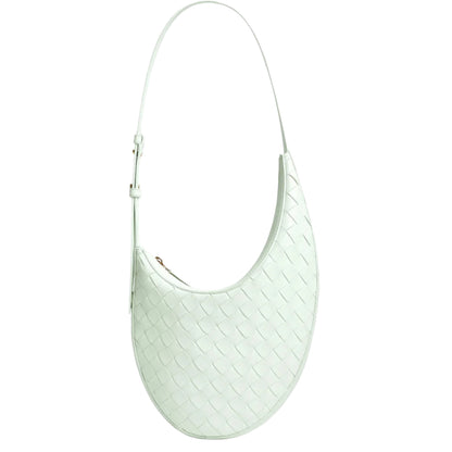 Light green handbag with a textured pattern on a white background