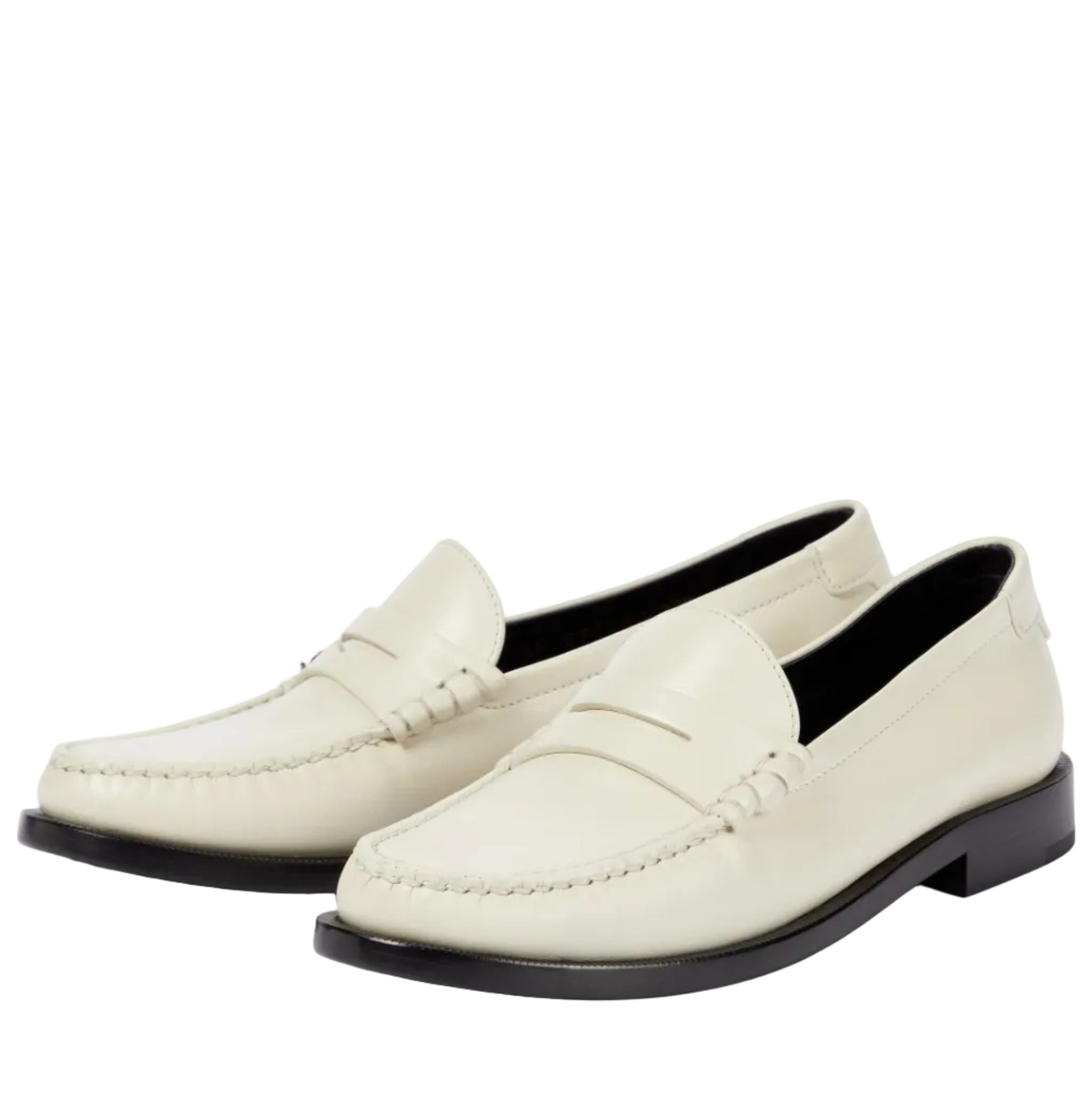 Pair of white loafers on a light gray background