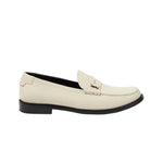 White loafer shoe on a light gray background