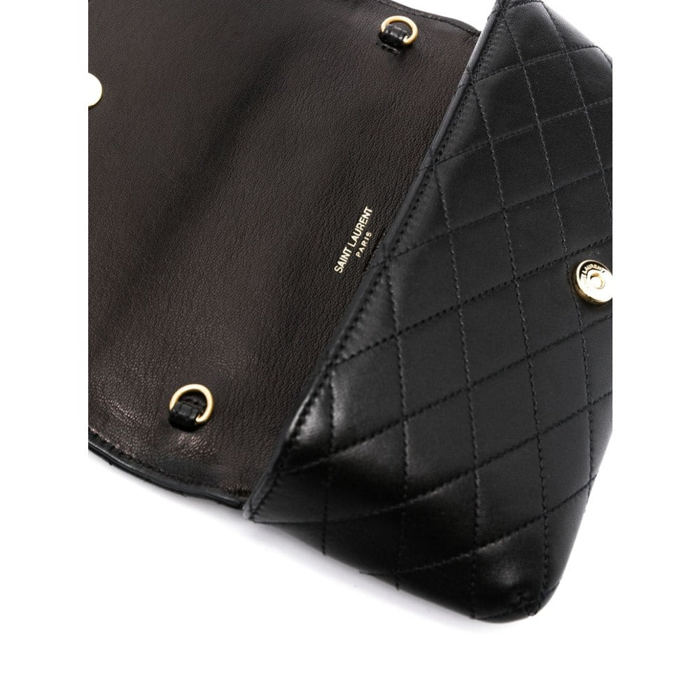 Black quilted handbag with gold accents on a white background