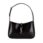 Black handbag with a brand logo on a white background