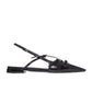 Black sandal with a minimalist design on a white background