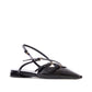 Black pointed-toe flat with thin straps on a white background