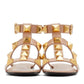 Beige sandals with gold pyramid studs on a white background