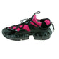 Black and pink sneakers with unique sole design on a white background