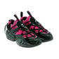 Pair of pink and black athletic shoes on a white background
