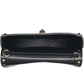 Black leather clutch bag with gold accents on a white background