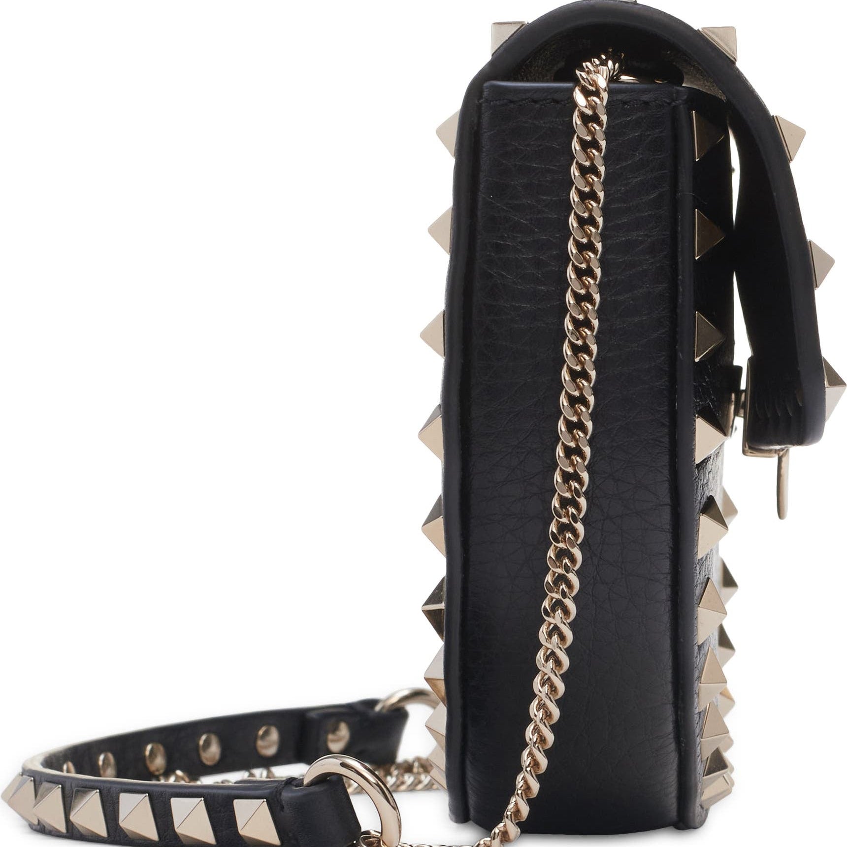 Black studded handbag with gold chain strap on a white background