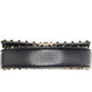 Black leather dog collar with gold studs on a white background