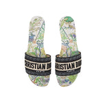 Pair of Christian Dior slides with floral pattern on a white background