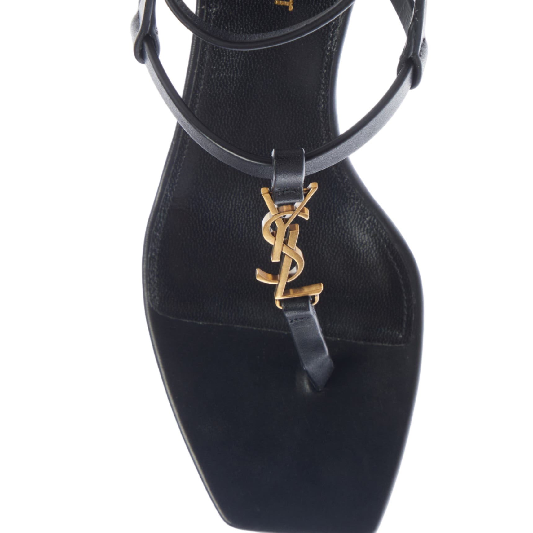 Black sandal with gold logo on a white background