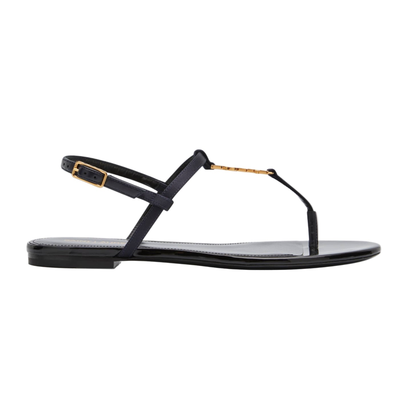 Black sandal with gold accents on a white background