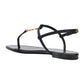Black sandal with thin straps on a white background