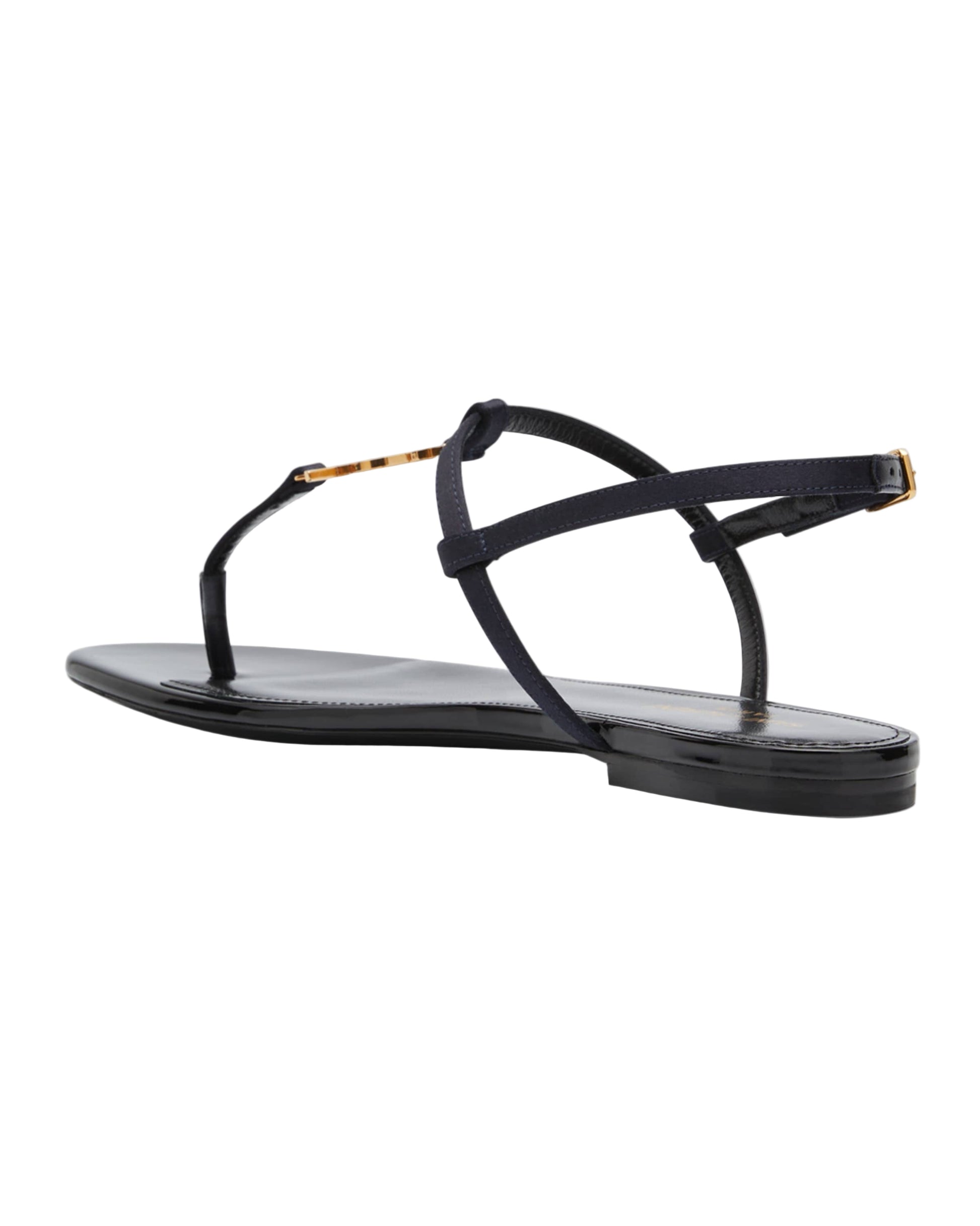 Black sandal with thin straps on a white background