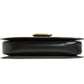 Black handbag with gold clasp on a white background