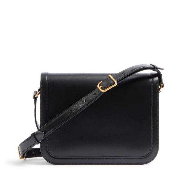 Black leather handbag with a gold buckle on a white background