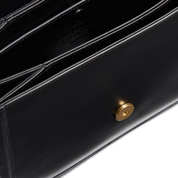 Close-up of a black leather wallet with a gold button on a white background
