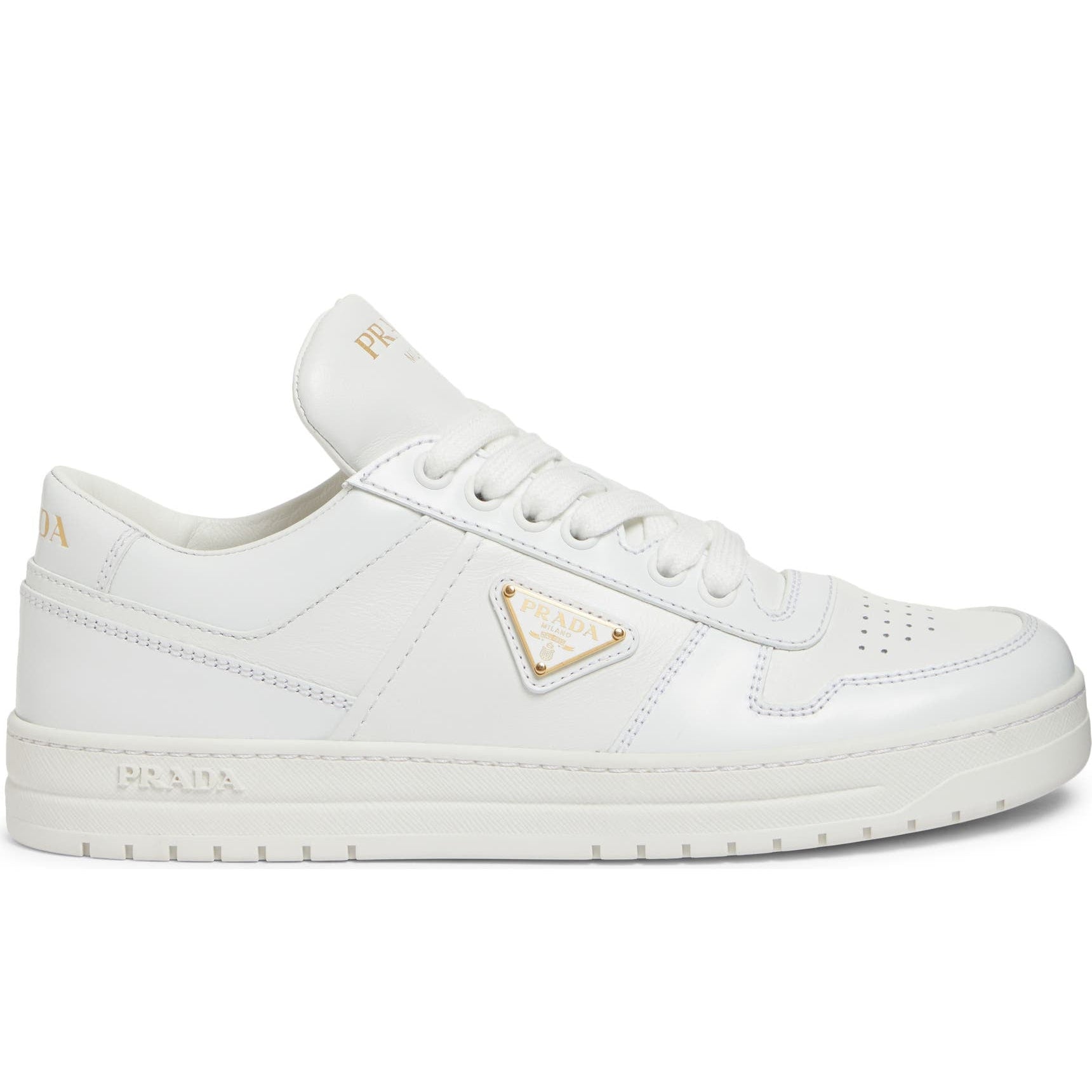 White sneakers with a gold triangle logo on a white background