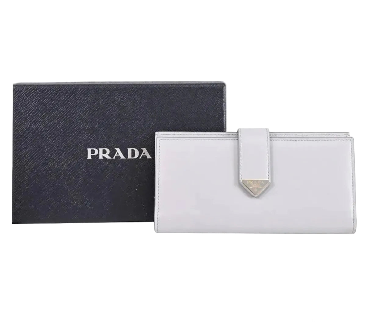 White Prada wallet with black Prada box on a white background