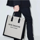 Person holding a Rive Gauche Saint Laurent tote bag on eBay
