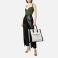 Woman holding a handbag on eBay product page