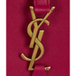 Close-up of a red handbag with a gold logo on a white background