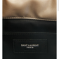 Close-up of a Saint Laurent bag with a beige top and black bottom section.