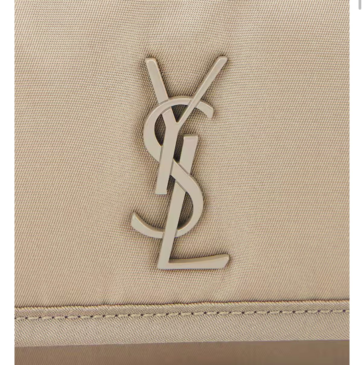 Close-up of a beige fabric with a logo on a screen