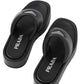 Black Prada sandals on a white background
