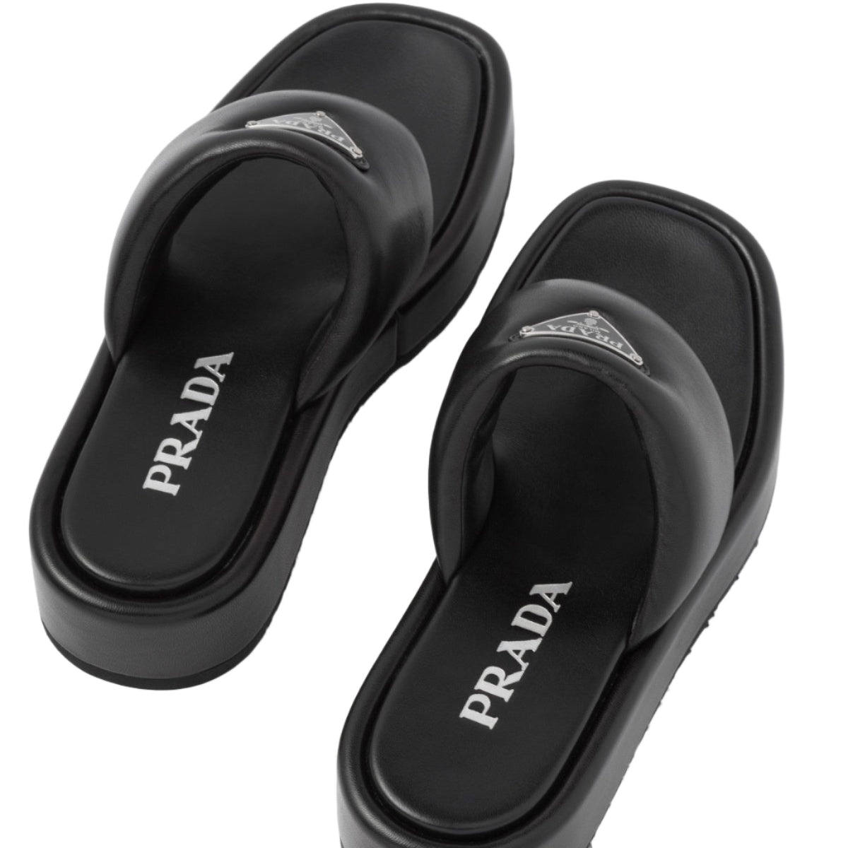 Black Prada sandals on a white background