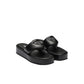 Black sandals with a brand logo on a light gray background