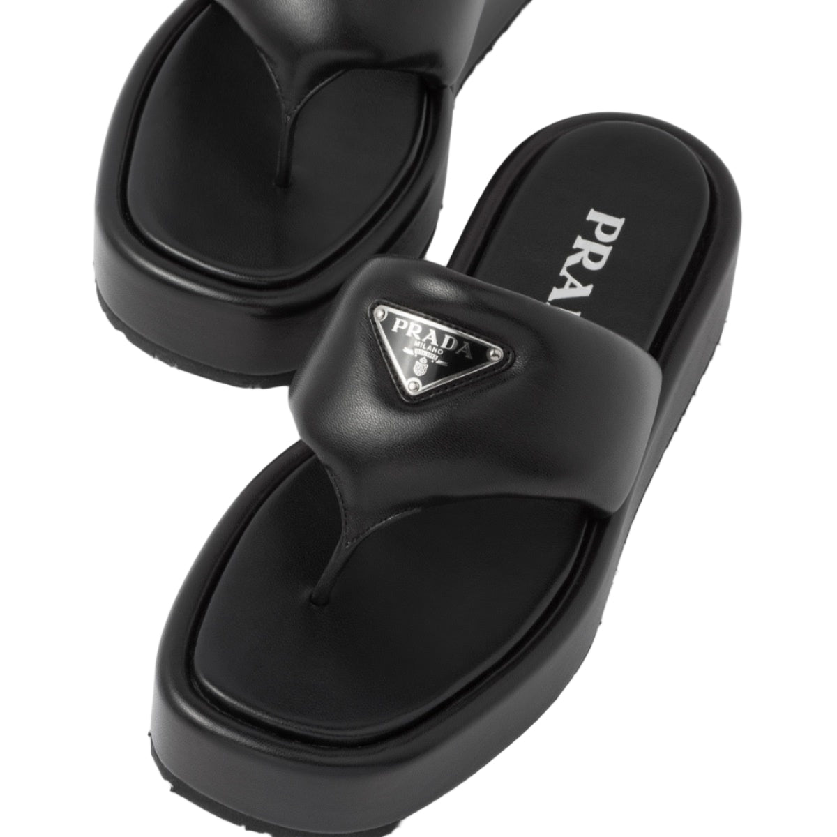 Black Prada sandals on a white background