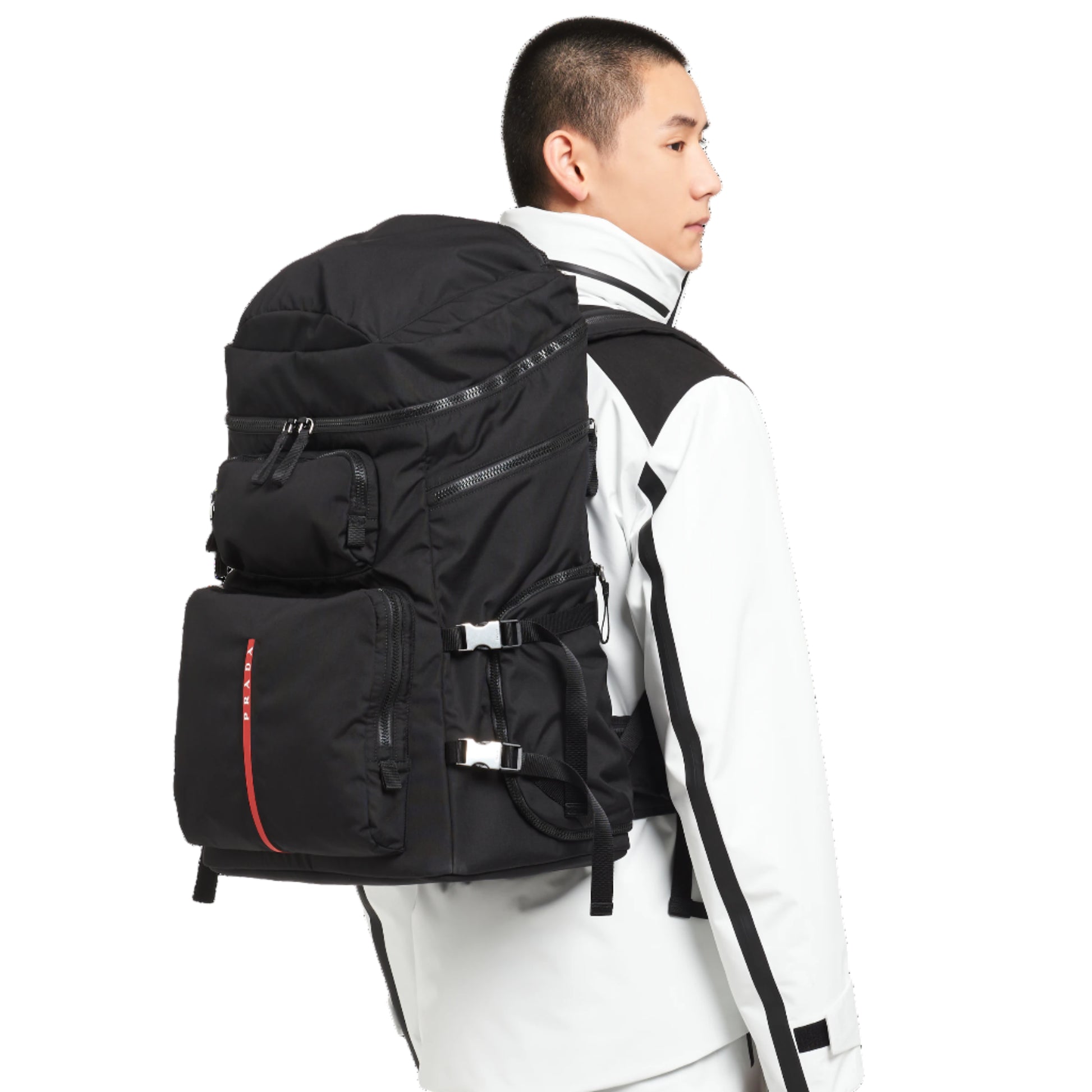 Person wearing a black backpack on a white background