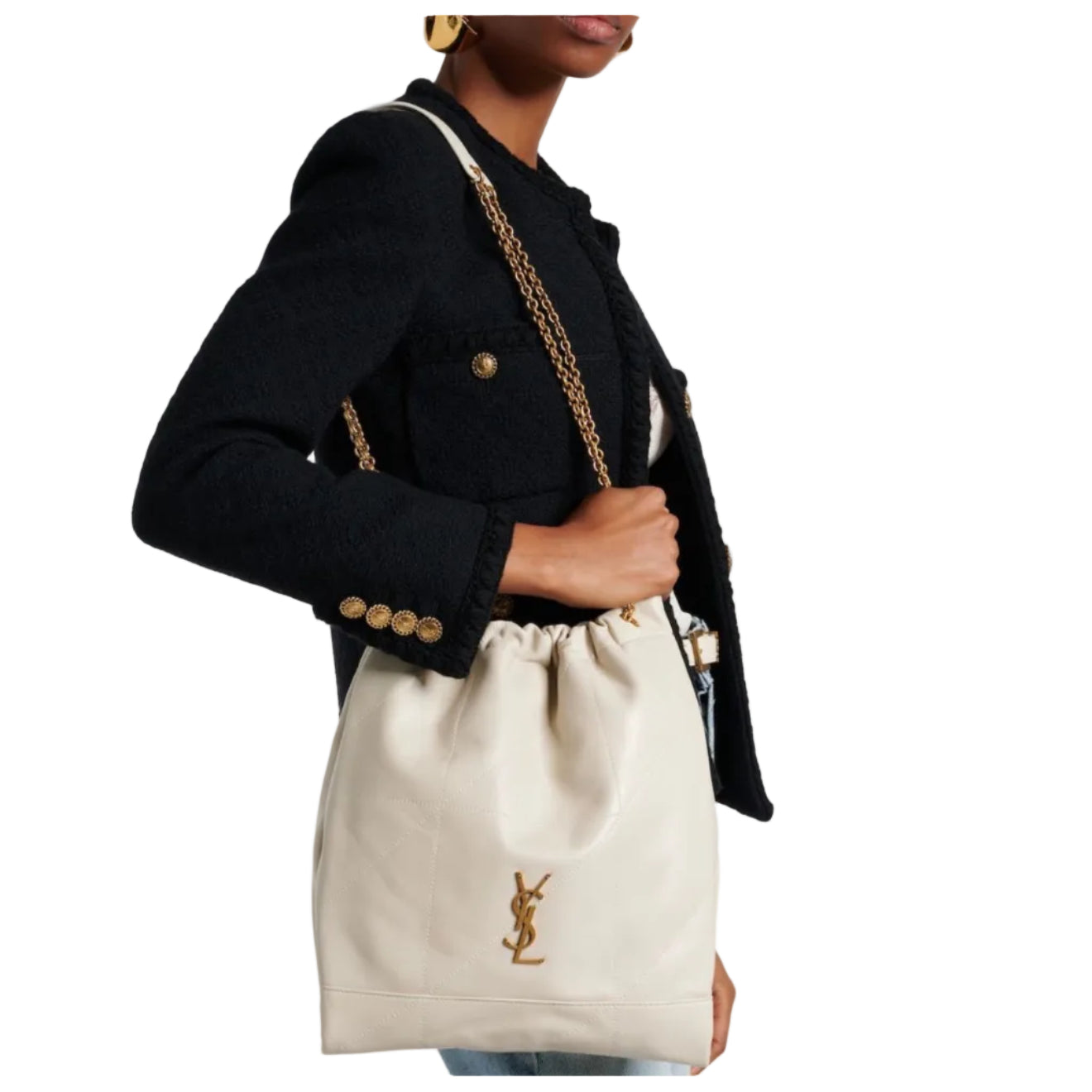 Person holding a beige drawstring bag with a brand logo against a white background