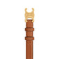 Brown leather belt with gold buckle on a light gray background