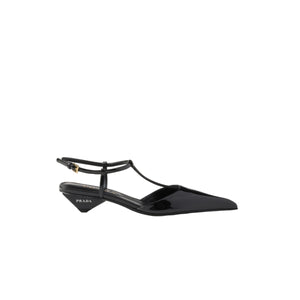 Black sandal with a thin strap on a white background
