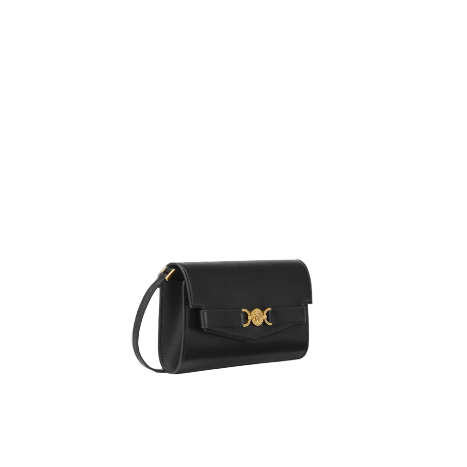 Black handbag with a gold emblem on a white background