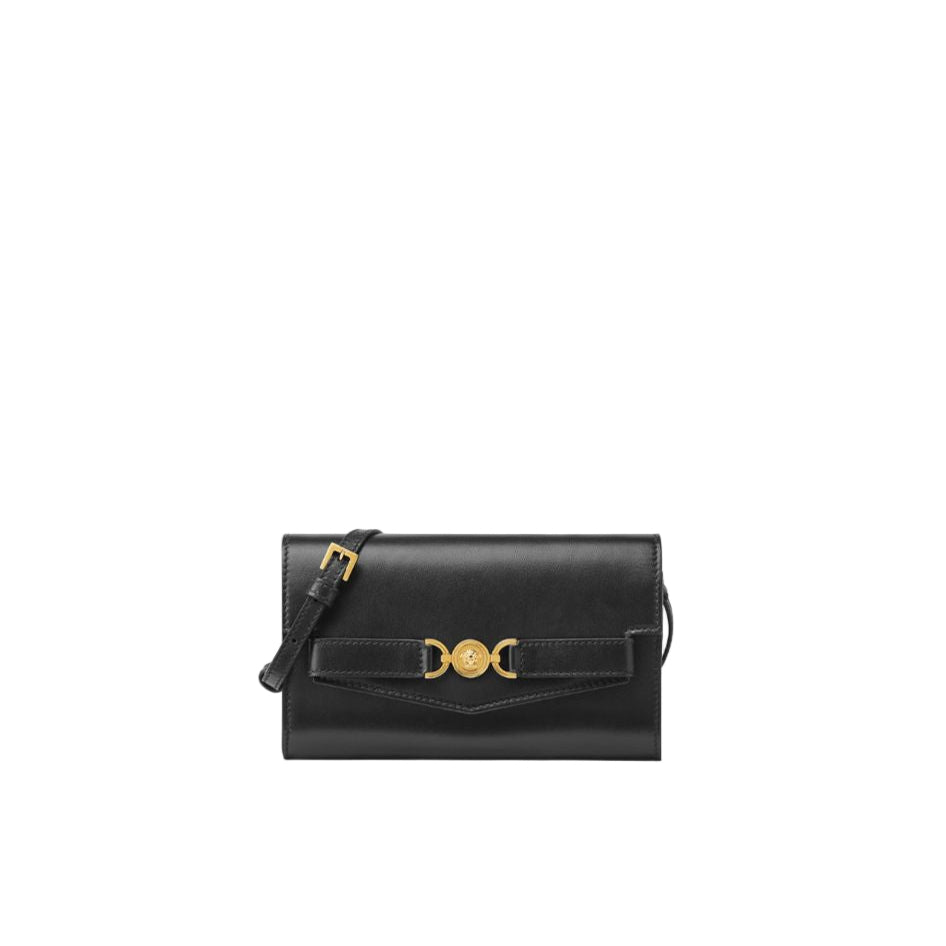 Black handbag with gold accents on a white background