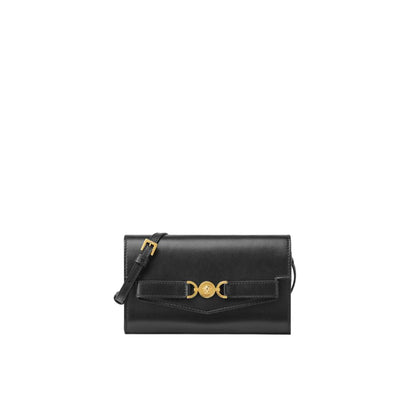Black handbag with gold accents on a white background