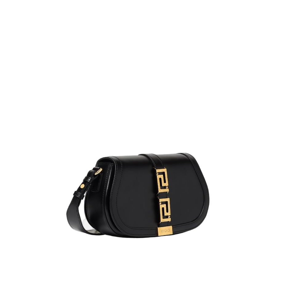 Black handbag with gold accents on a white background