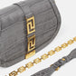 Gray handbag with gold accents on a white background