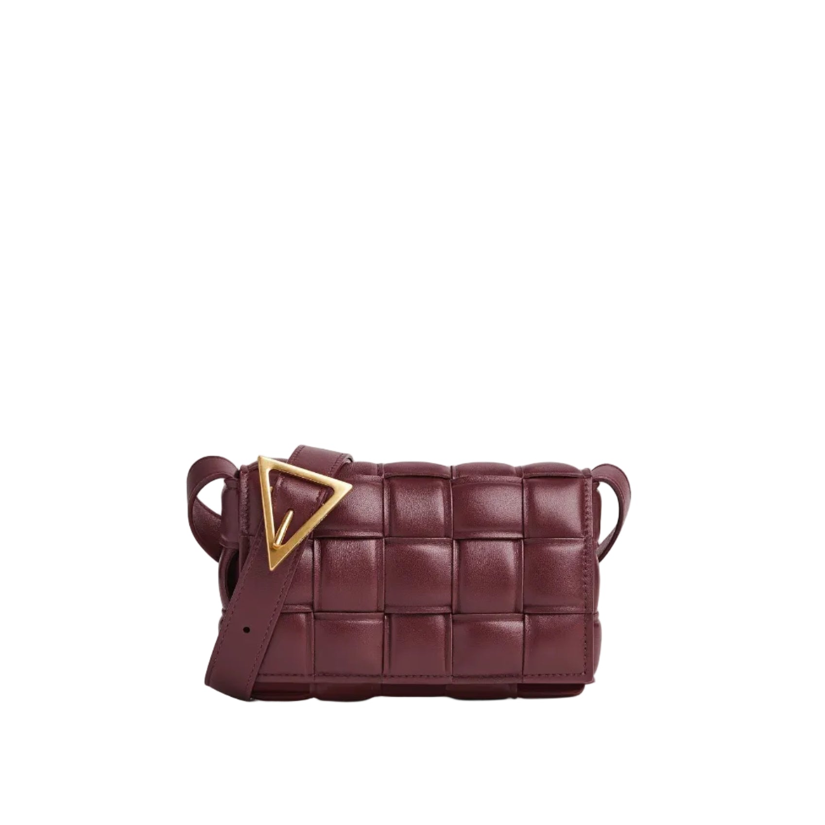 Maroon woven handbag with a gold triangle accent on a light gray background