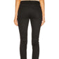 Black jeans worn by a person on a white background