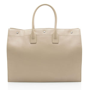 Beige handbag with silver hardware on a white background