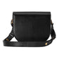 Black crossbody bag on a light gray background