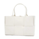 White woven handbag on a white background