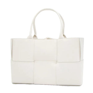 White woven handbag on a white background