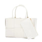 White quilted tote bag with a matching pouch on a white background