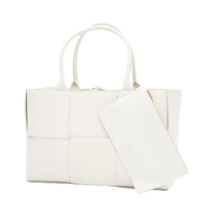 White quilted tote bag with a matching pouch on a white background