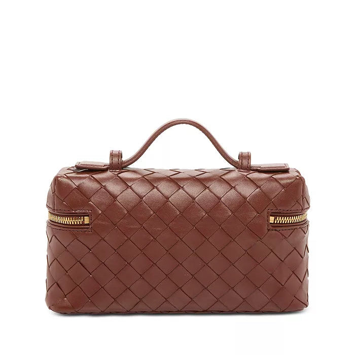 Brown woven handbag with gold zipper on a white background